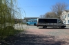 Ukraine, Chernobyl Tour with Solo East - our Solo East minibus waits for the tour group in Chernobyl while a local bus does the rounds of the town....