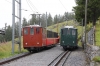 SPB (Schynige Platte) He2/2 #62, built in 1910, departs Breitlauenen with 655 1125 Wilderswil - Schynige Platte as SPB (Schynige Platte) He2/2 #18, built in 1910, waits to depart Schynige Platte with 646 1141 Schynige Platte - Wilderswil