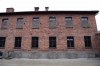 Poland - Auschwitz 1 concentration camp Block 11, which was the camp jail. The courtyard of Block 11 had a "Death Wall" where those condemned to death were shot by firing squad. The windows of the cells & upper rooms in the block were built so that those inside couldn't see the executions.