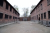 Poland - Auschwitz 1 concentration camp Block 10 (L) and Block 11 (R) in Block 10 medical experiments were carried out on women prisoners; the windows of block 10 looking into the courtyard were covered by wooden screens to prevent those inside being able to witness the executions at the "Death Wall" in the courtyard. Block 11 was the camp jail. The courtyard of Block 11 had a "Death Wall" where those condemned to death were shot by firing squad. The windows of the cells & upper rooms in Block 11 were built so that those inside couldn't see the executions.