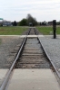 Poland, Auschwitz II - Birkenau - Main entrance gate looking towards the "ramp" where prisoners were offloaded from the trains, the railway spur wasn't built until the Spring of 1944