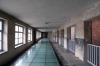 Poland, Auschwitz II - Birkenau - Camp Bathhouse - the "Sauna" - where new arrivals were processed. Corridor to the shower room; known as the "dirty corridor"