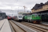 Uppsala (L-R) Upptaget EMU 9064 waits with 8434 1109 Uppsala - Gavle, SJ X3000 EMU departs with 567 1014 Gavle - Stockholm Central and Green Cargo Rd2 1097 awaits a path out of the station