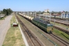 BCh VL80S-581 runs through Zlobin with a freight while ChME3-4090 waits its next work