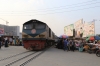 BR MEL15 2718 departs Biman Bandar with a train for Dhaka Kamlapur