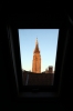 Bruges, Belgium - Church of our Lady as seen through the roof window of room No.10 at the Hotel De Goezeput