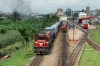 CamRail GM GT26CU-3 CC3301 sits at Yaounde with a container train while Grindrod Pembani Remgro (GPR Leasing Africa) GM GL30SCC-3 GPR30-07 arrives with IC151 0600 Douala - Yaounde Intercity