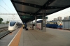 CR DF4-5012 waits at Beijing Dong with a set of empty stock while shing new high-speed EMU CRH6A-0623 arrives with S106 1834 Tongzhou - Beijing Xi