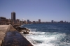 View down Malecon as the Straits of Florida lap up against the sea wall on the north of Havana