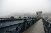 Budapest - Szechenyi Chain Bridge with Budapest Royal Palace in the mist