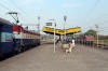 KZJ WAG7 27296 waits at Jharsuguda Jn with 58112 2130 (P) Itwari Jn - Tatanagar while SRC WAP4 22878 runs through with 12262 0820 Howrah - Mumbai CST Duronto Express