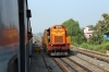 BNDM WDM3D 11412 eases 18005 2130 (P) Howrah - Jagdalpur into Sambalpur Jn; BNDM WDG3A 13422 waits outside the station to drop onto the rear and shunt the Sambalpur portion off the train