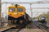 JHS WDG4D 70559 waits to depart Jhansi Jn with 51805 1725 Jhansi Jn - Banda Jn passenger while ET WDM3A 16220 prepares to shunt KTE WDG4D 70725 and the stock for 51828 1810 Jhansi Jn - Itarsi Jn into the main station; the GM would go dead in tow behind AJNI WAG7 27263 on 51828