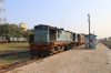 IZN YDM4 6500 waits departure from Mailani Jn with 52256 1455 Mailani Jn - Bahraich