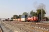 KTE WDG3A 14643sets off north from Marwar Jn with a double-stack container train, leaving BGKT WDG4 12198 to wait the road behind it, with a conventional freight