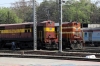 KZJ WDM2S 017673 & KZJ WDG3A 14974 wait in the yard by the station at Secunderabad Jn