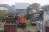 JMP WDM3A 16055, in ex works condition, stands round the back of Jamalpur Wagon shops while four forlorn Alco's rot away inbetween the wagons; the only identifiable one of which was ex HWH WDM3A 17957