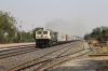 BGKT WDG4 12270 runs through Ambli Road with a container train