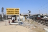 KJM WDM3D 11521 waits to depart Ahmedabad Jn with 16588 2210 (P) Bikaner Jn - Yesvantpur Jn, BRC WAP5 30056 waits in an adjacent platform with 19036 1420 Ahmedabad Jn - Vadodara Jn