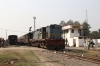 IZN YDM4 6520 departs Pilibhit Jn with 52233 1400 Pilibhit Jn - Shahjahanpur Jn, with Ex NKE, now IZN YDM4 6636 stabled in the carriage sidings