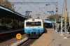 MMTS EMU departs Begumpet with 47131 0843 Lingampalli - Hyderabad; metro works can be seen above the station in the background