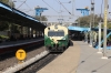 An EMU departs Begumpet with 67249 0615 Tandur - Secunderabad; metro works can be seen above the station in the background