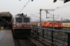 BRC WAP7 30114 waits to depart  Ahmedabad Jn with 19034 1810 Ahmedabad Jn - Valsad and alongside is ROZA WDG4G 49065