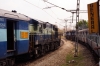 KJM WDG3A 13043 runs parallel to 12252 0800 (P) Korba - Yesvantpur, headed by KJM WDM3D's 11522/11520, as it runs an empty stock into Yesvantpur Jn