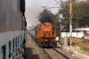 ERS WDM3A 14076 notches up after clearing the platform at Vadodara Jn while departing with 16337 0200 Okha - Ernakulam Jn