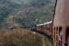 LMG YDM4 6177 leads 15693 0615 Lumding Jct - Silchar as it passes the construction site for the new viaduct that will take the new BG line away from Lower Haflong