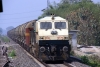 WDP4 12179 approaches New Jalpaiguri with a tank train