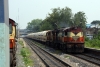 VSKP WDM3A 16249 leads 18311 1310 Sambalpur Jct - Varanasi through Sambalpur Road as VSKP WDG3As 13078/569 run through with a freight