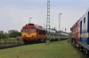 MAV M62 628194 waits at Csajag with 16907 0653 Zahony - Tapolca, while MAV 418118 runs through in the opposite direction with 19705 1140 Tapolca - Budapest Deli