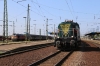 MAV Cargo M62 628327 stands in the yard at Debrecen while Bobo 449014 sits with a freight in the middle road