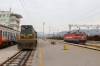 ZCG Cargo 644015 stands in the station at Podgorica, acting as station pilot, while ZCG Cargo 461030 stands in the adjacent yard