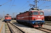 ZCG 461039 stands at Podgorica with 6103 0930 Bijelo Polje - Bar local while ZCG Cargo 461030 runs through the adjacent yard