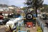 Plinthed ONR steam loco 37390 outside Coonoor station; ONR X Class steam loco 37399 (built in 2014) shunts off ONR steam loco shed behind it to work forward with 56137 1400 Udagamandalam (Ooty) - Mettupalayam