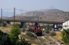 OSE MLW MX627 A465 heads up the bank at Aspropirgos as it works the weekly Monday's only oil train from the Aspropirgos refinery to Athens; this is the only train that uses this otherwise disused section of track