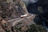 Running through the Andes just prior to going through the spiral tunnel down to Surco, on board FCCA's 0700 Huancayo - Lima Los Desamparados tourist train; led by FCCA GE C30-7 1007 and FCCA GE C30-7 1001 can be seen down at Surco itself