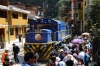 Peru Rail Alco DL532 #356 & MLW DL535 #482 wait their next turns of duty in the street at Aguas Calientes while hoards of locals await the arrival of Local Train #21 0700 Cusco San Perdro - Hidroelectrica; which was that full that locals had to be put on the 1330 Machu Picchu - Hidroelectrica Expedition train!