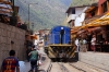 Peru Rail MLW DL535 #481 runs through the street at Aguas Calientes, back up to Machu Picchu, after turning on the wye outside of town