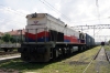 TCDD GM DE33031 heads through Muratli with a container train