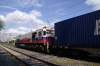 TCDD GM DE33031 heads through Muratli with a container train