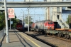 RZD 3ES5K-252 runs through Ugolnaya with an eastbound freight towards Vladivostok. 3TE10UK-0050A/V/B are stabled in the bay platform