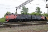 RZD 2TE10M-2692B/A brings up the rear of a ballast train being drawn into the yard at Khabarovsk 1 by 2ES5K-144 with 2TE10M-0521A/B dead inside