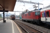 SBB Re4/4 11198 waits at Arth Goldau with IR2417 1009 Zurich Hbf - Locarno while BLS Re4/4 165 arrives with a test train formed of SBB stock