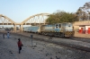 Ex IR YDM4 CC1504 (6496) waits orders at Dakar Hann with 313 0710 Dakar Cyrnos - Rufisque; which was caped at Thiaroye to form an earlier up working back due to a DMU having problems at Rufisque