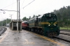 SZ 664118 departs Rakek in the pouring rain while it drags MV483 1505 Ljubljana - Rijeka to Prestranek