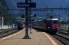 SBB Cargo Re4/4 11329 banks a freight out of Erstfeld as SBB re4/4 11198 arrives with IR2182 1347 Locarno - Basel