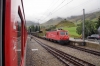 MGB Deh4/4 II #95 departs Realp with 537 1037 Andermatt - Visp while HGe4/4 II #105 sits with a car train for Oberwald